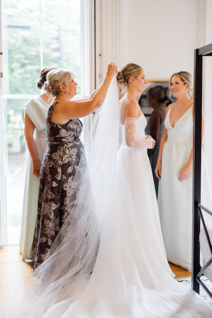 Bride getting ready with mom and sisters